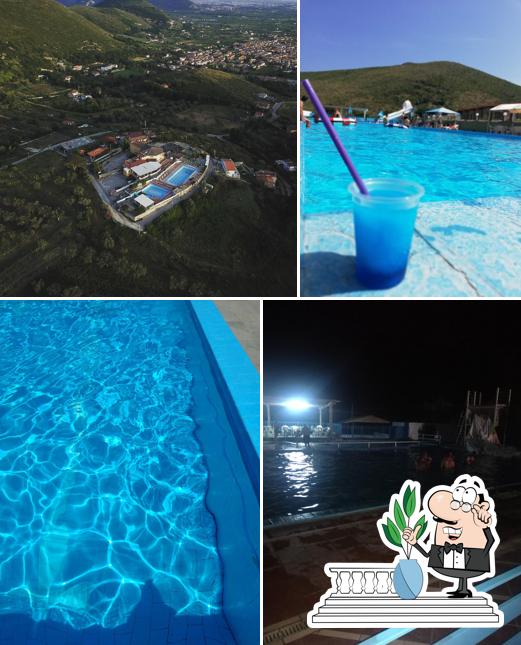 Puoi goderti l'aria fresca da seduto all'esterno di Ristorante - Pizzeria "Le 3 Piscine"