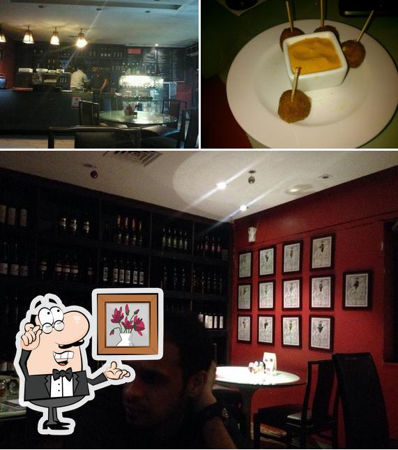 The photo of interior and food at Ivy Wine Cafe & Bistro