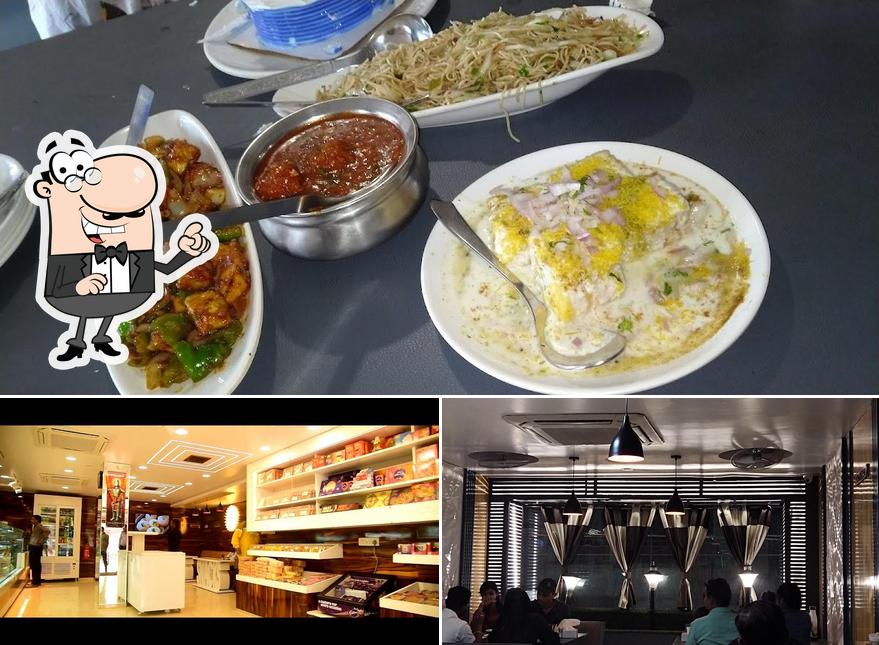 This is the picture depicting interior and food at Laxminarayan Mithaiwala