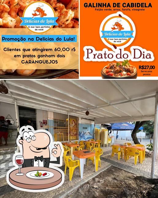 A ilustração da comida e interior a Delícias do Lula - Bar e Comedoria