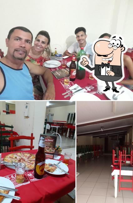 A foto do Pizzaria Casa Nossa - Sete Lagoas/MG’s interior e mesa de jantar