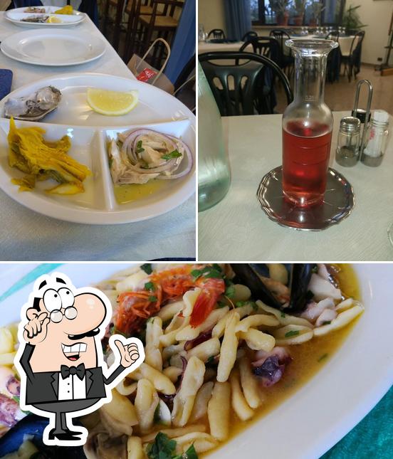 Questa è la immagine che presenta la interni e cibo di Ristorante Da Micchele