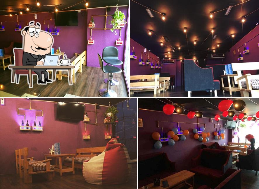 Take a seat at one of the tables at Cozy Cafe