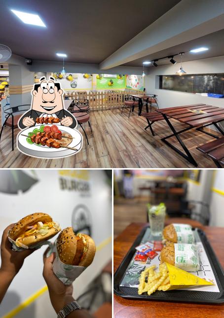 Take a look at the image showing food and interior at Biggies Burger: CG Road