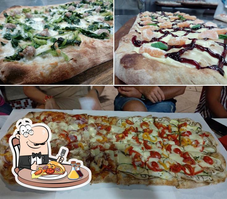 A Pizzeria Asso Di Cuori, puoi assaggiare una bella pizza