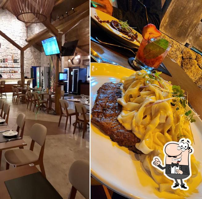 Sente em uma das mesas no Cambucá Bar & Restaurante