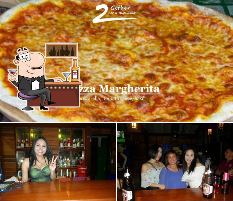 The photo of 2Gether Bar & Pizza Restaurant’s bar counter and pizza