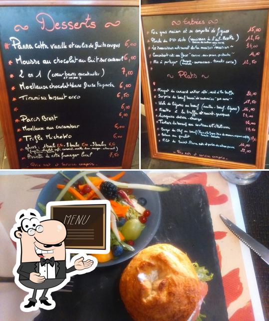 This is the picture depicting blackboard and food at Le P'tit Resto