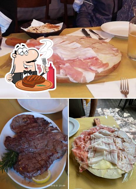 Ordina i un pasto a base di carne a Hiltonn Trattoria