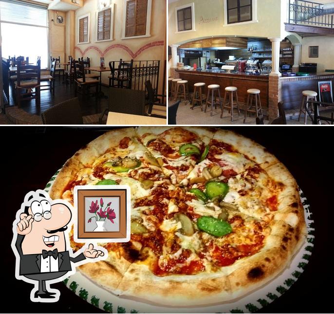 La immagine di interni e pizza da Pizzerija Capitollino