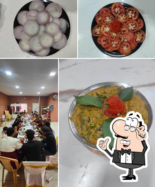Take a seat at one of the tables at Balaji Cafe & Restaurant