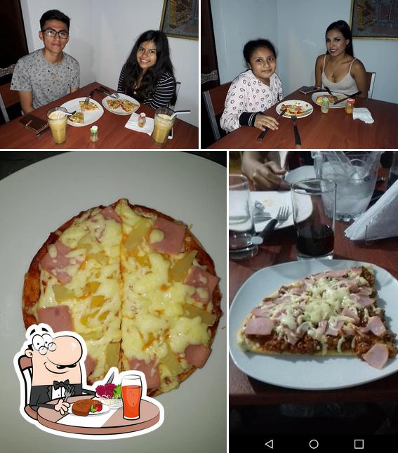 Las fotos de comedor y comida en Pizzería Camila