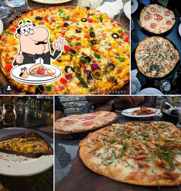 Get pizza at Zarza Club and Terrace Jaipur