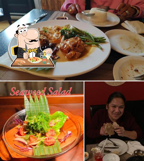 Take a look at the photo depicting food and dining table at Sinaing Home of Filipino Cuisine