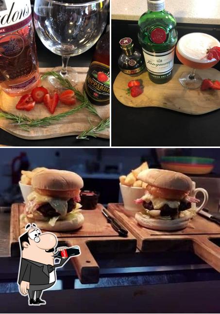 Take a look at the picture depicting drink and burger at The Begging Dog - Bar & Bistro