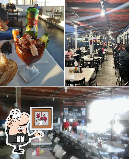 This is the picture displaying interior and exterior at Mariscos Arcos Playas