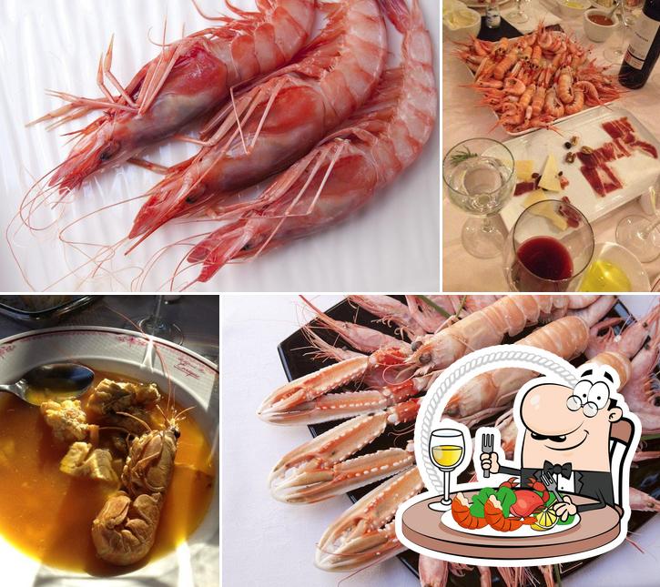 Отведайте блюда с морепродуктами в "Restaurante Enrique"