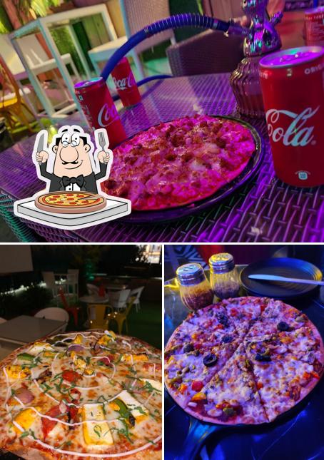 Get pizza at Sneakout cafe