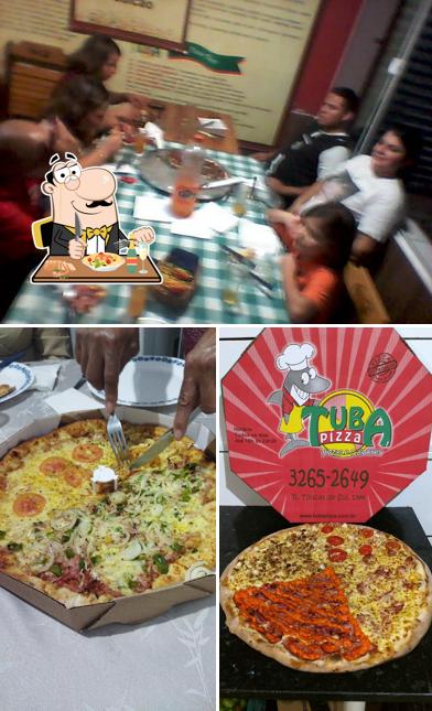 A ilustração do Tuba Pizza Sítio Cercado’s comida e interior