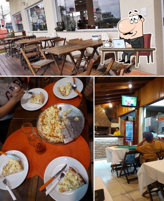 A foto do Padaria Restaurante e Pizzaria Nova Rosa de Ouro’s interior e mesa de jantar