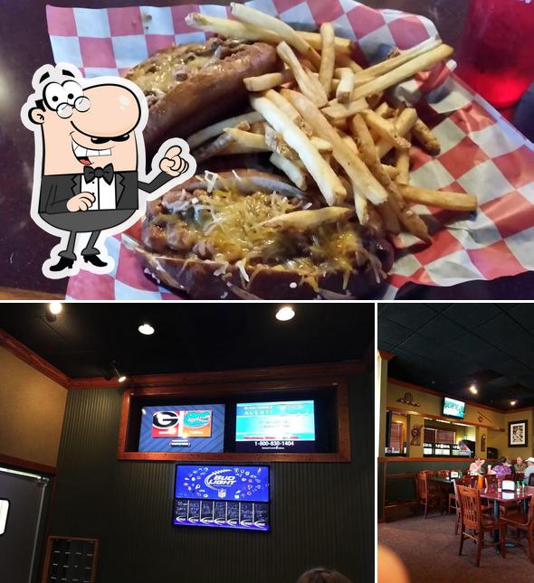 Check out the photo showing interior and food at Winner's Grill