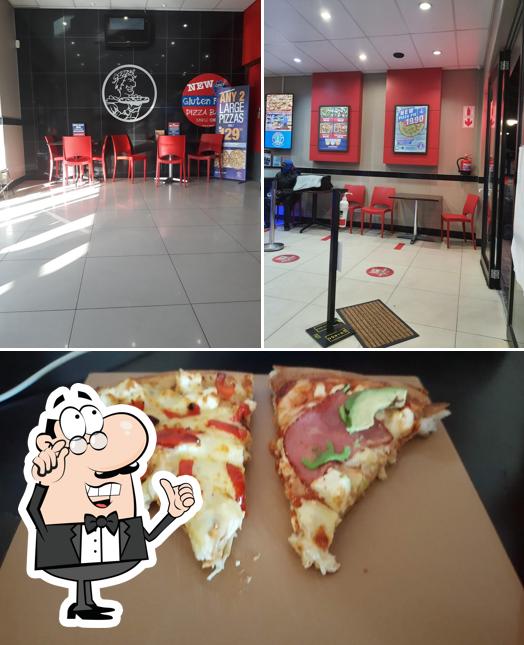 Check out the image displaying interior and pizza at Roman's Pizza PE Sunridge Village