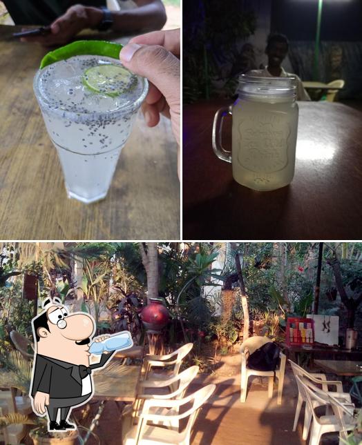 Take a look at the picture displaying drink and dining table at The Secret Garden Restaurant