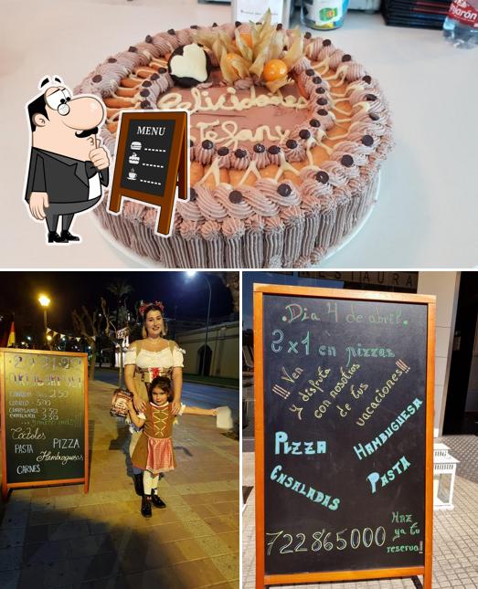 This is the picture depicting blackboard and cake at La Plaza
