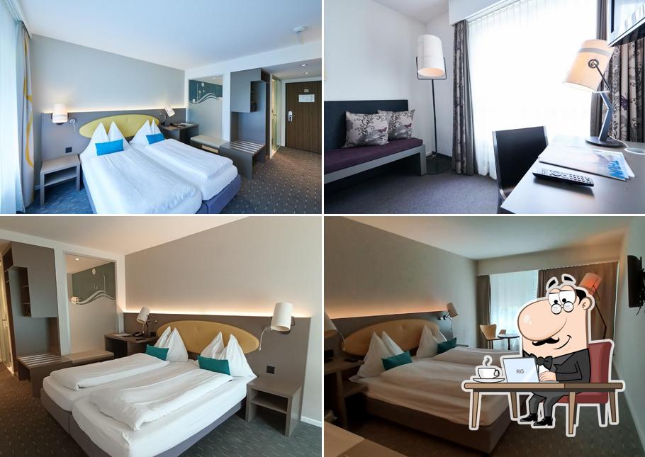 Siediti a un tavolo di Hotel Restaurant Holiday Thun