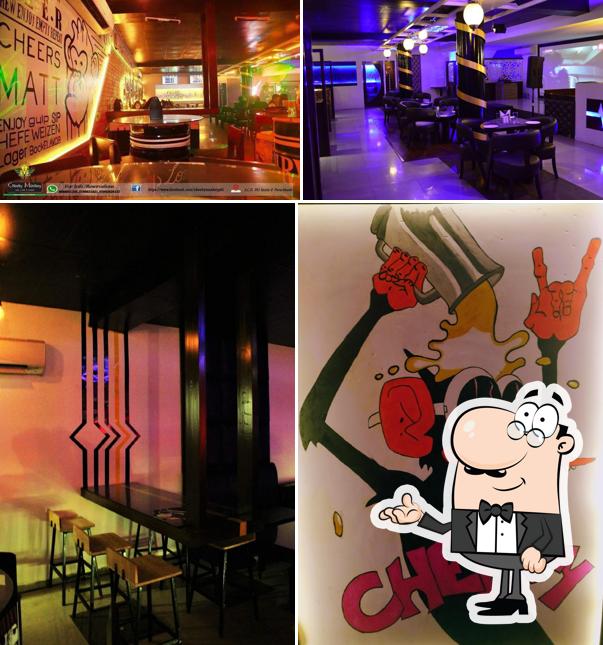 Take a seat at one of the tables at Cheeky Monkey