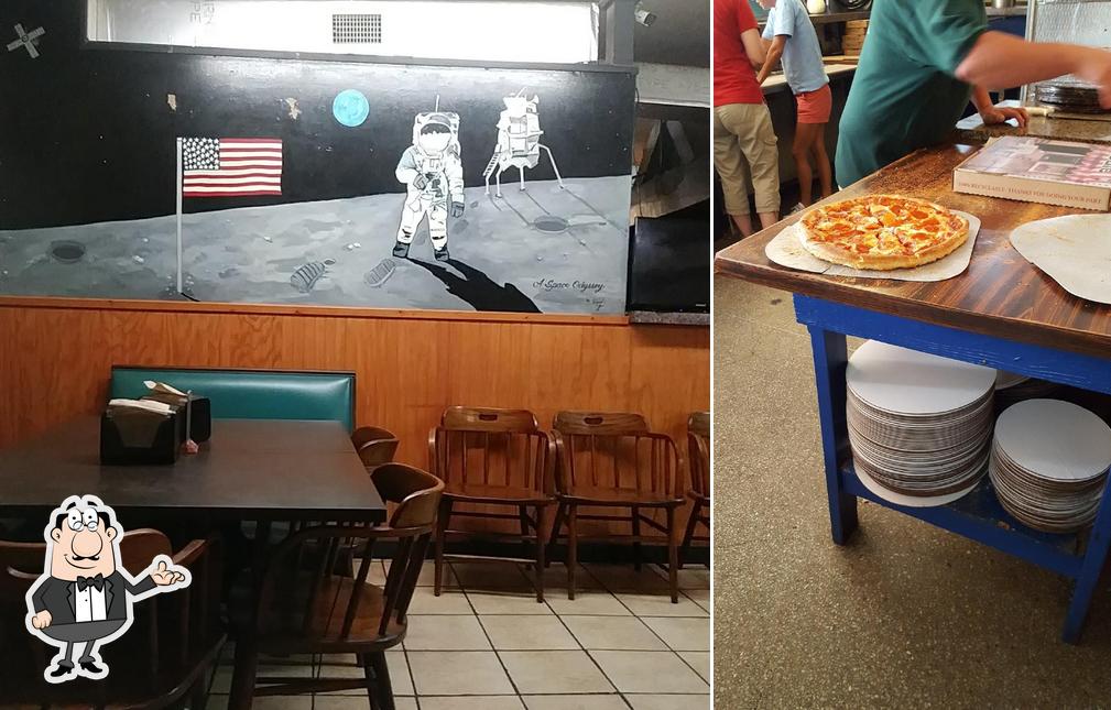 Take a seat at one of the tables at Odyssey Pizza & Subs