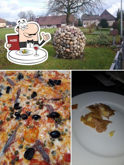 Pizzeria Winznau si caratterizza per la cibo e esterno