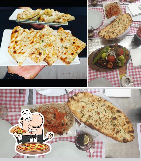 Попробуйте пиццу в "Restaurante Dawat Kebab"