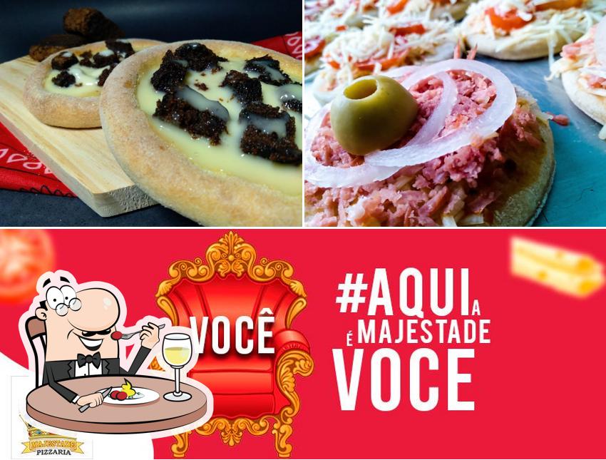 Entre diversos coisas, comida e interior podem ser encontrados a Majestade Pizzaria