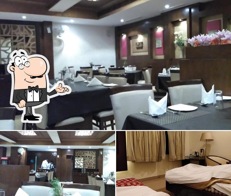 Take a seat at one of the tables at Hotel Surya Plaza