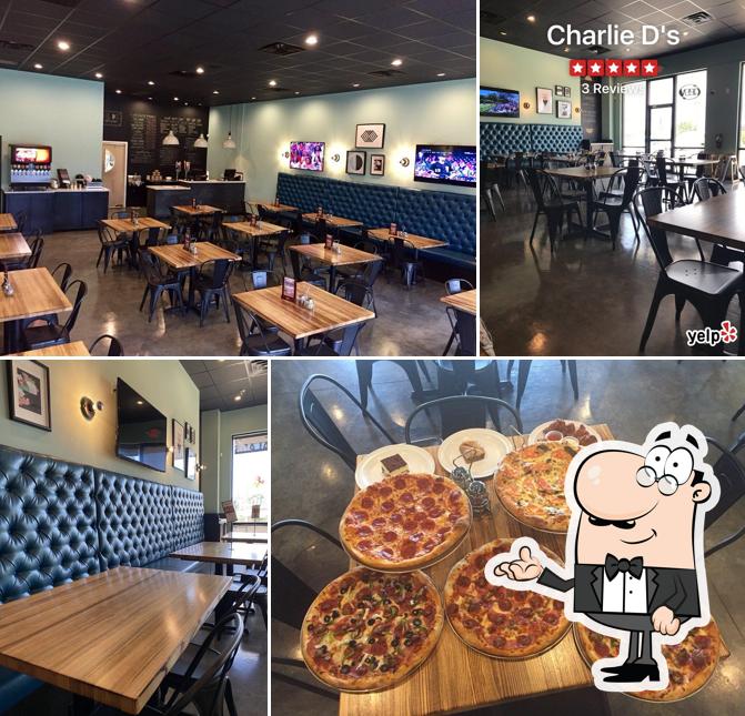Take a seat at one of the tables at Charlie D's pizza