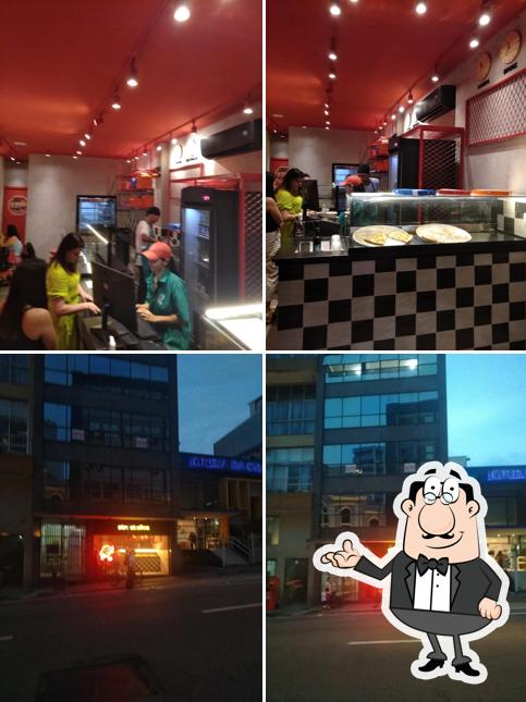 A imagem da interior e exterior a Street Slice Pizza