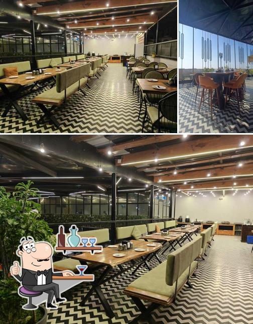 Take a seat at one of the tables at TGIB : The Grand Indian Buffet , Malviya Nagar - Jaipur (Pure Veg Buffet Restaurant )