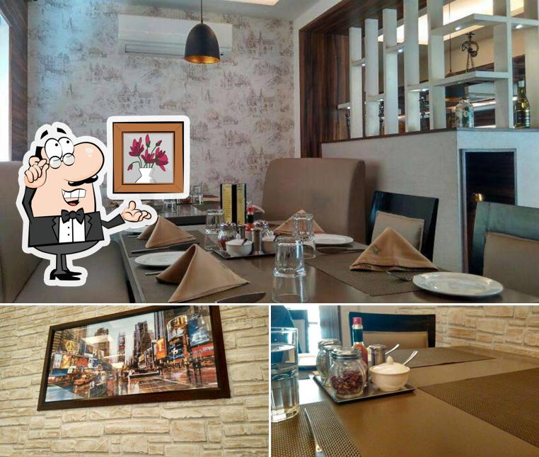 Take a seat at one of the tables at Little Italy Restaurant, Anna Nagar Chennai