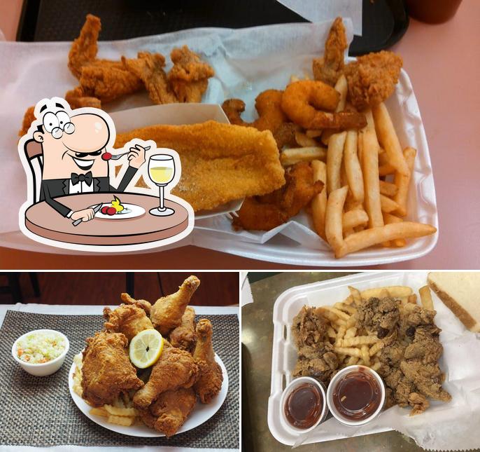 The photo of food and dining table at Super JJ Fish & Chicken