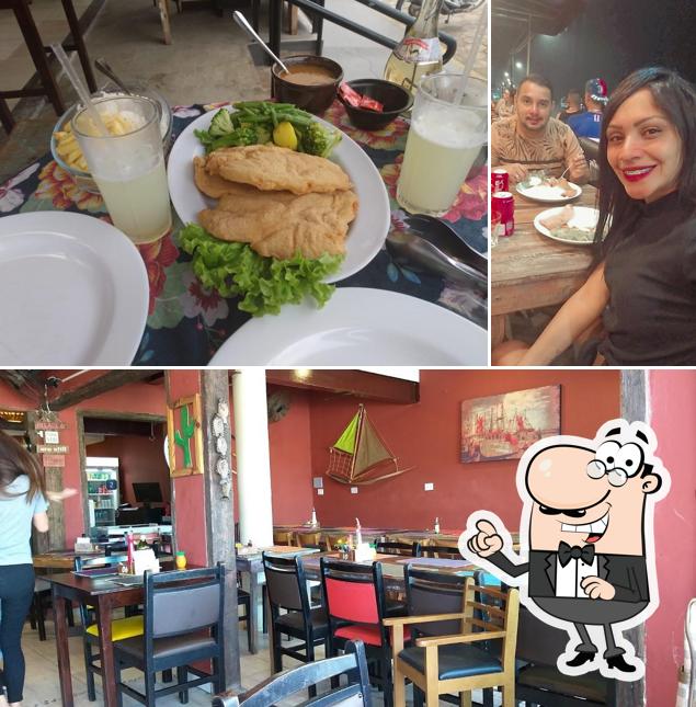 Esta é a imagem ilustrando interior e mesa de jantar a Porto Bar E Restaurante Ubatuba