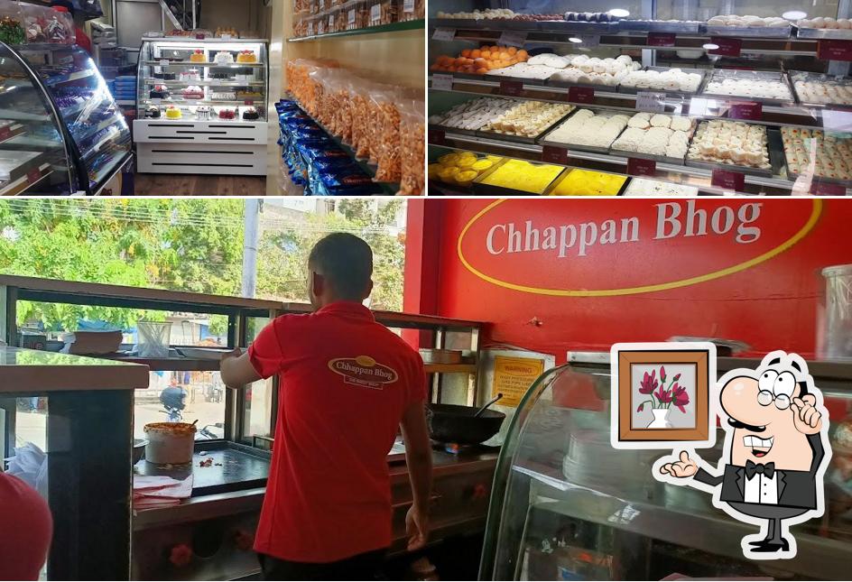 Take a seat at one of the tables at Chhapan bhog sweet shop