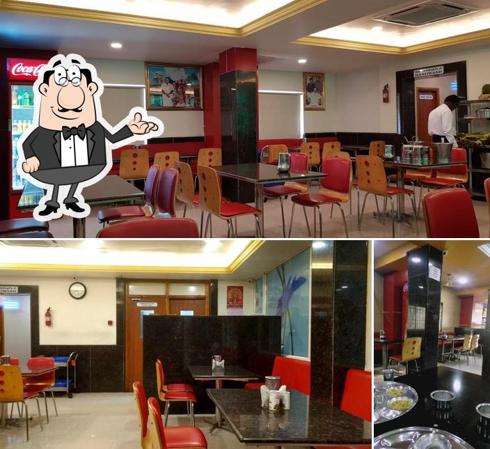 Take a seat at one of the tables at Saravana Bhavan