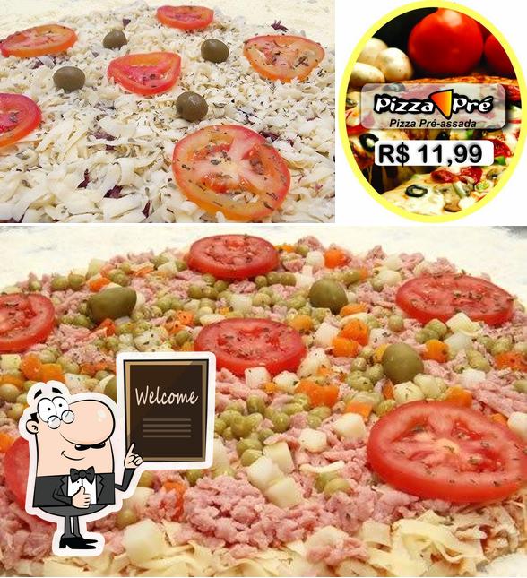 Look at the image of Pizzas