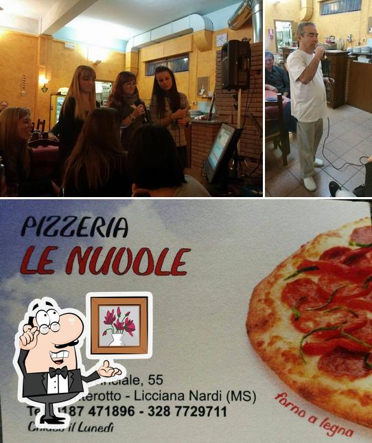 Guarda la immagine che raffigura la interni e pizza di Pizzeria LE Nuvole