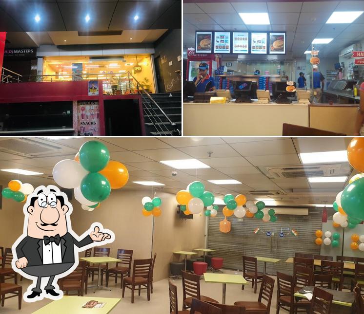 Take a seat at one of the tables at Domino's Pizza Mubarik Mehal Colony, Sangrur