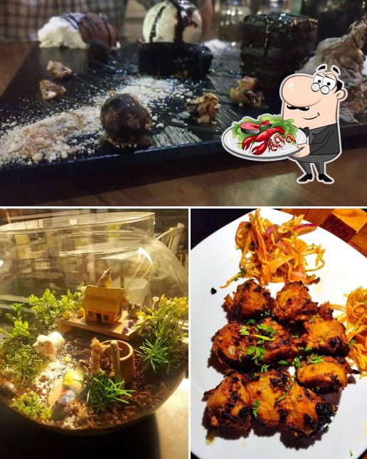Try out seafood at द Vegeटेबल