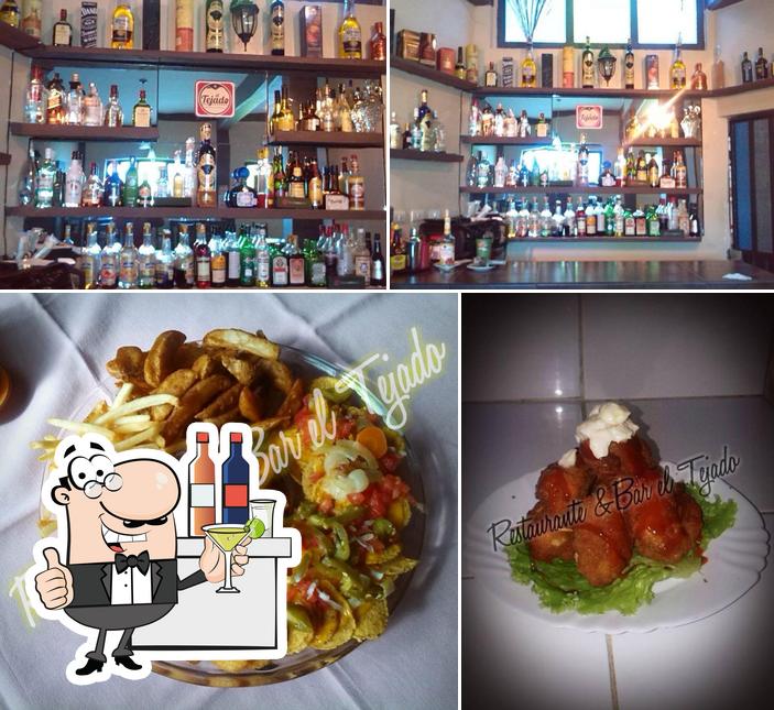 The photo of Restaurante Bar El Tejado’s bar counter and food