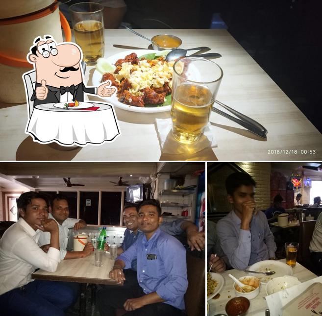 Among various things one can find dining table and food at Jay Bharat Bar & Restaurant