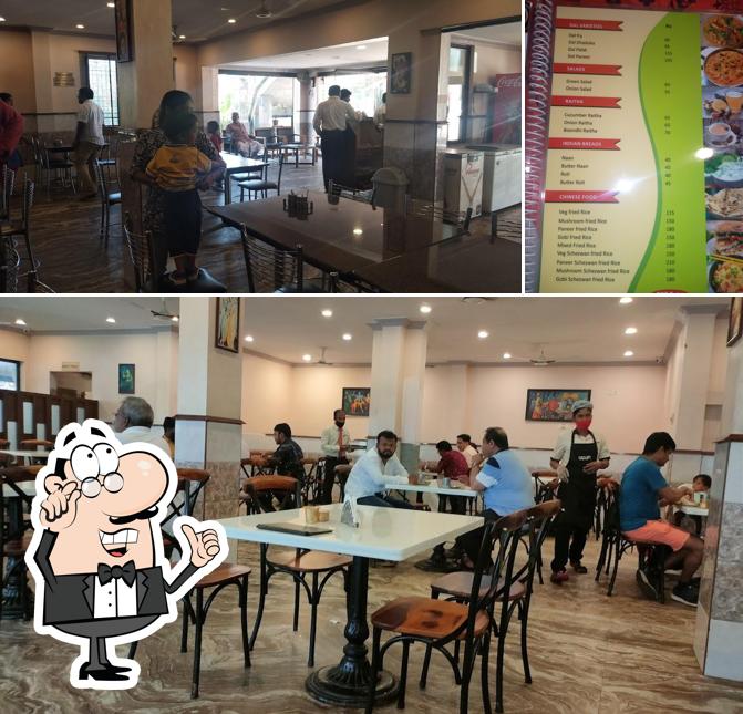 Check out the photo displaying interior and burger at Udupi International Restaurant